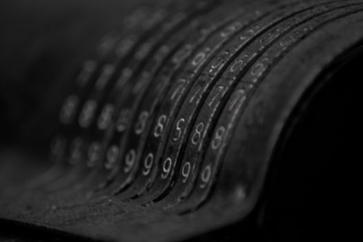 Closeup of an old vintage cash register with lots of numbers