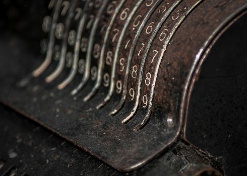 Closeup of an old vintage cash register with lots of numbers