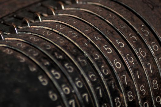 Closeup of an old vintage cash register with lots of numbers