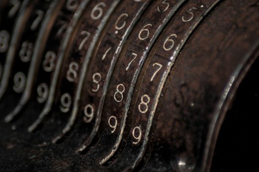 Closeup of an old vintage cash register with lots of numbers