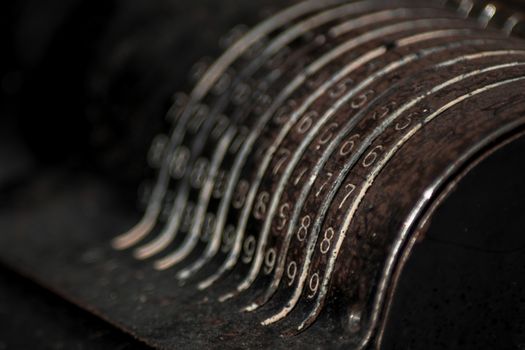 Closeup of an old vintage cash register with lots of numbers