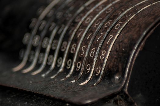 Closeup of an old vintage cash register with lots of numbers