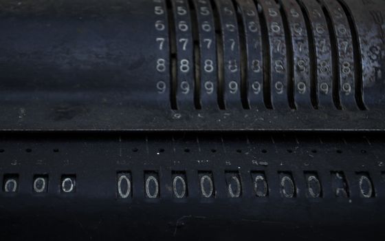 Closeup of an old vintage cash register with lots of numbers