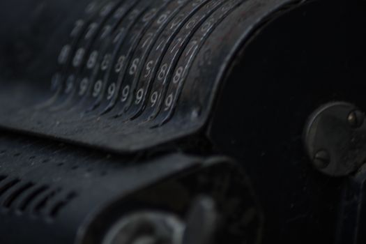 Closeup of an old vintage cash register with lots of numbers