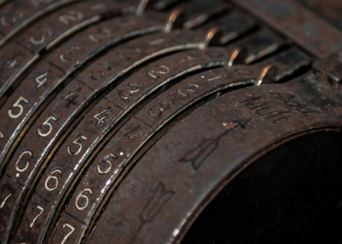 Closeup of an old vintage cash register with lots of numbers