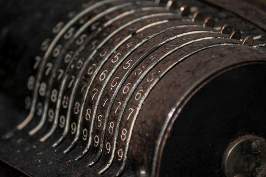 Closeup of an old vintage cash register with lots of numbers