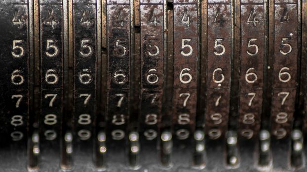 Closeup of an old vintage cash register with lots of numbers