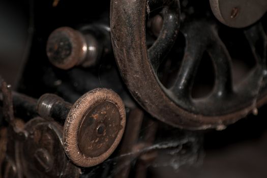 Closeup of the wheel on an old vintage sewing machine