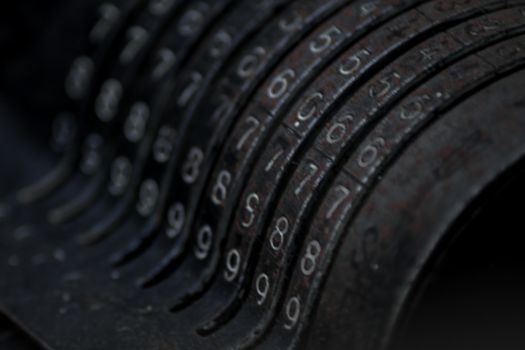 Closeup of an old vintage cash register with lots of numbers