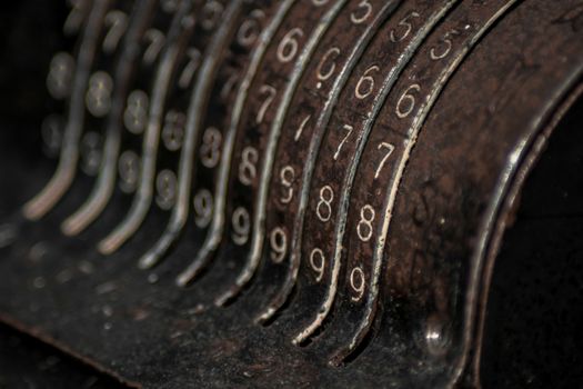 Closeup of an old vintage cash register with lots of numbers