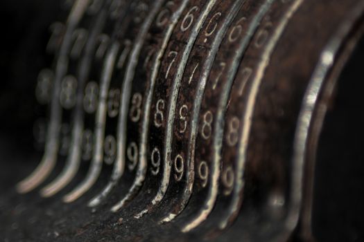 Closeup of an old vintage cash register with lots of numbers