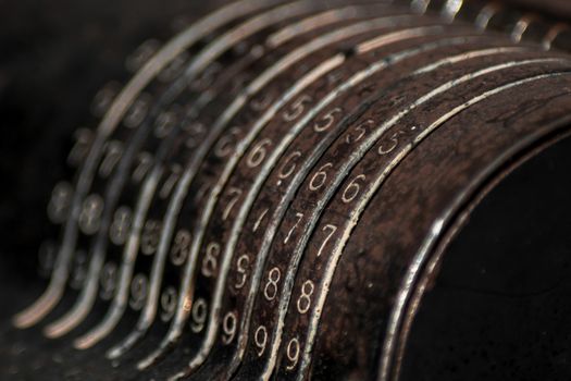 Closeup of an old vintage cash register with lots of numbers