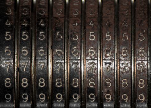 Closeup of an old vintage cash register with lots of numbers