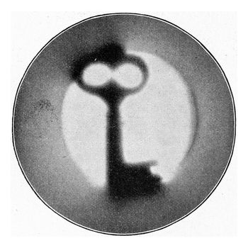 Photograph of a key with radium rays, vintage engraved illustration. From the Universe and Humanity, 1910.
