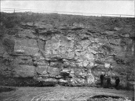 Profile view of the Eringsdorf limestone quarry near Weimar which contains remains of mammalian bones from Taubach hunters, vintage engraved illustration. From the Universe and Humanity, 1910.
