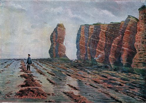 Pointed north of Helgoland Island at low tide, vintage engraved illustration. From the Universe and Humanity, 1910.
