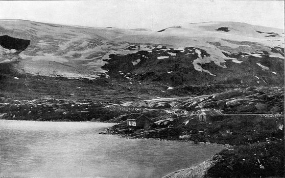 Mountainous landscape in Norway with its huge snowfields and descending glaciers, vintage engraved illustration. From the Universe and Humanity, 1910.
