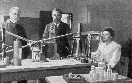 Mr and Mrs Curie in their laboratory, vintage engraved illustration. From the Universe and Humanity, 1910.
