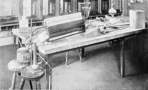 Special work table in the first chemical laboratory of the University of Berlin, vintage engraved illustration. From the Universe and Humanity, 1910.
