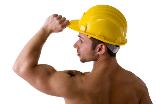 Muscular young construction worker shirtless with hardhat, isolated on white background, rearview