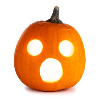 Shocked glowing halloween pumpkin isolated on white background