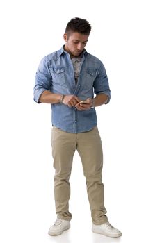 Handsome young man checking watch on his wrist, isolated on white. Full length shot