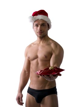 Christmas season: muscular bodybuilder shirtless wearing Santa Claus red hat, isolated on white