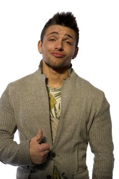 Smiling cool young man with wool sweater on white background looking at camera