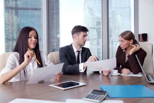 Business people working together at a meeting in modern office