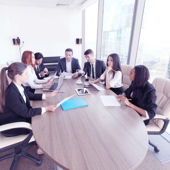 Business meeting of diverse people around the table