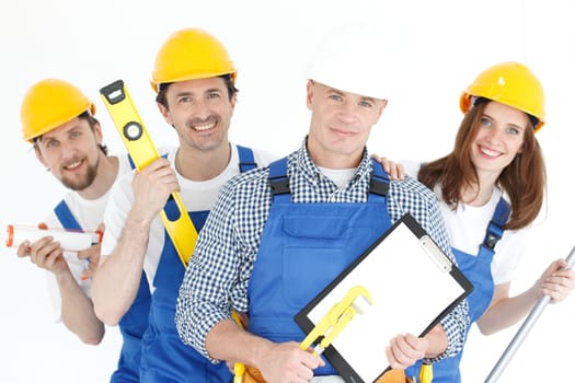 Team of happy smiling workers with tools and contract