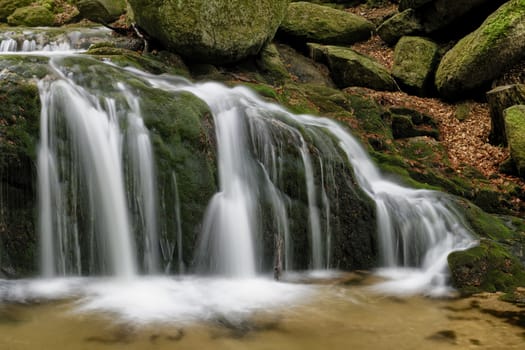 Beautiful Maly waterfall in super green spring forest surroundings, Czech Republic