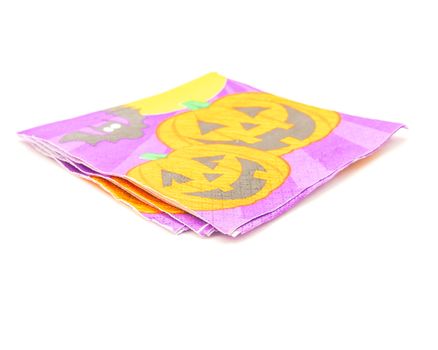 Three friendly Halloween napkins isolated on white background. Festive party tissues display pumpkins, bats, jack-o-lantern