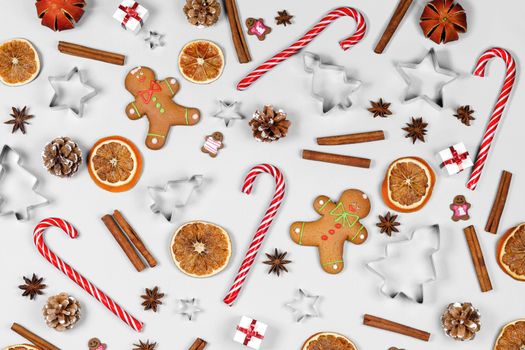 Christmas food frame. Gingerbread cookies, spices and decorations on white background with copy space