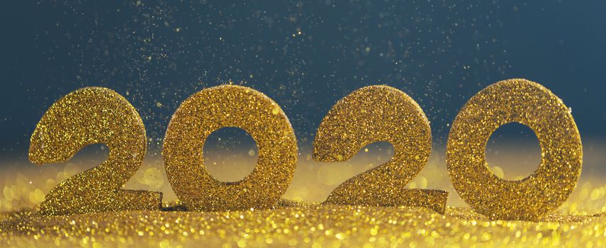 2020 New Year luxury design concept. Golden 2020 New Year horizontal template with golden glitter on blue backgound