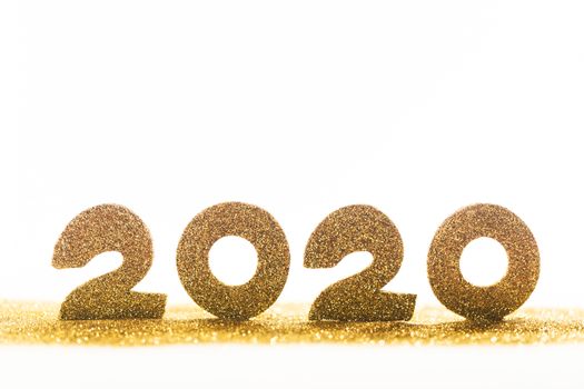2020 New Year luxury design concept. Golden 2020 New Year horizontal template with golden glitter isolated on white backgound