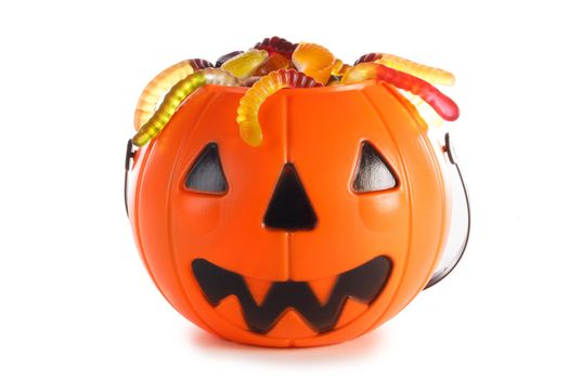 Halloween candies in Jack-O-Lantern bag isolated on white background