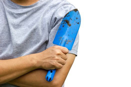 Gardener holding garden trowel and cross one's arm. Isolated on white background and clipping path. Concept of agriculture. Closeup and copy space for text.