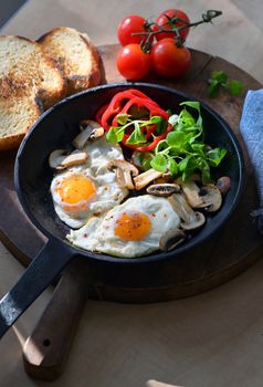 Fried Eggs And Vegetables In A Frying Pan