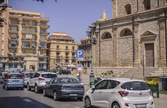 View of a street in the village of Gela with its daytime life in the south of Sicily in Italy.