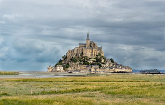 Normandy abbey attraction for vacation tourism in cloudy weather