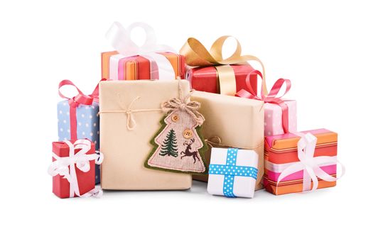 A pile of beautifully wrapped Christmas gifts isolated on white background.