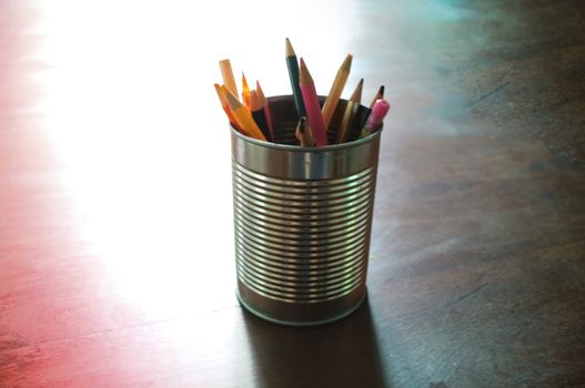 Pen and pencils in tin can, wood table , Concept Back to school