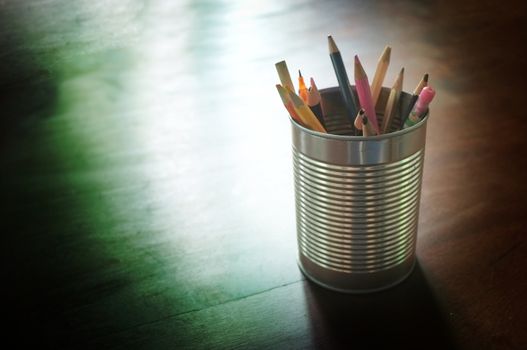 Pen and pencils in tin can, wood table , Concept Back to school