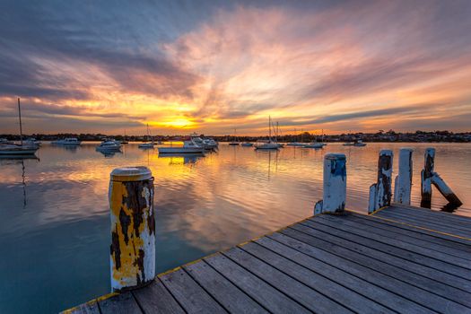 Yachts and boats moored on the tranquil waters of Lilyfield at sunset