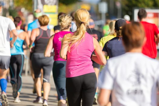 Group of active people running in the city. Healthy lifestyle. Weight Loss. Urban marathon run.