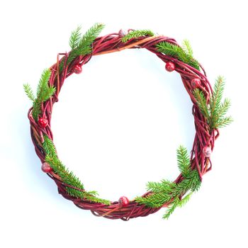 Christmas wreath of fir tree branches and red berries isolated on white background copy space for text border frame for text