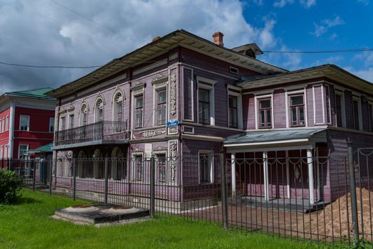 Vologda, Russia - July 28, 2019:  Old wooden house with carved windows in Gogol Street, 51, Vologda city (Russia)