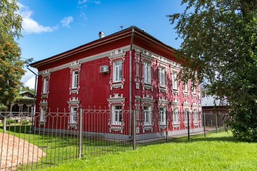 Vologda, Russia - July 28, 2019: Old red wooden house with carved windows in Gogol Street, Vologda city (Russia)