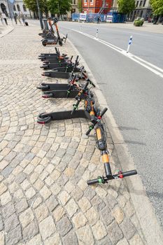 Stockholm, Sweden. September 2019.  some electric scooters pulled down by the wind in a city center street